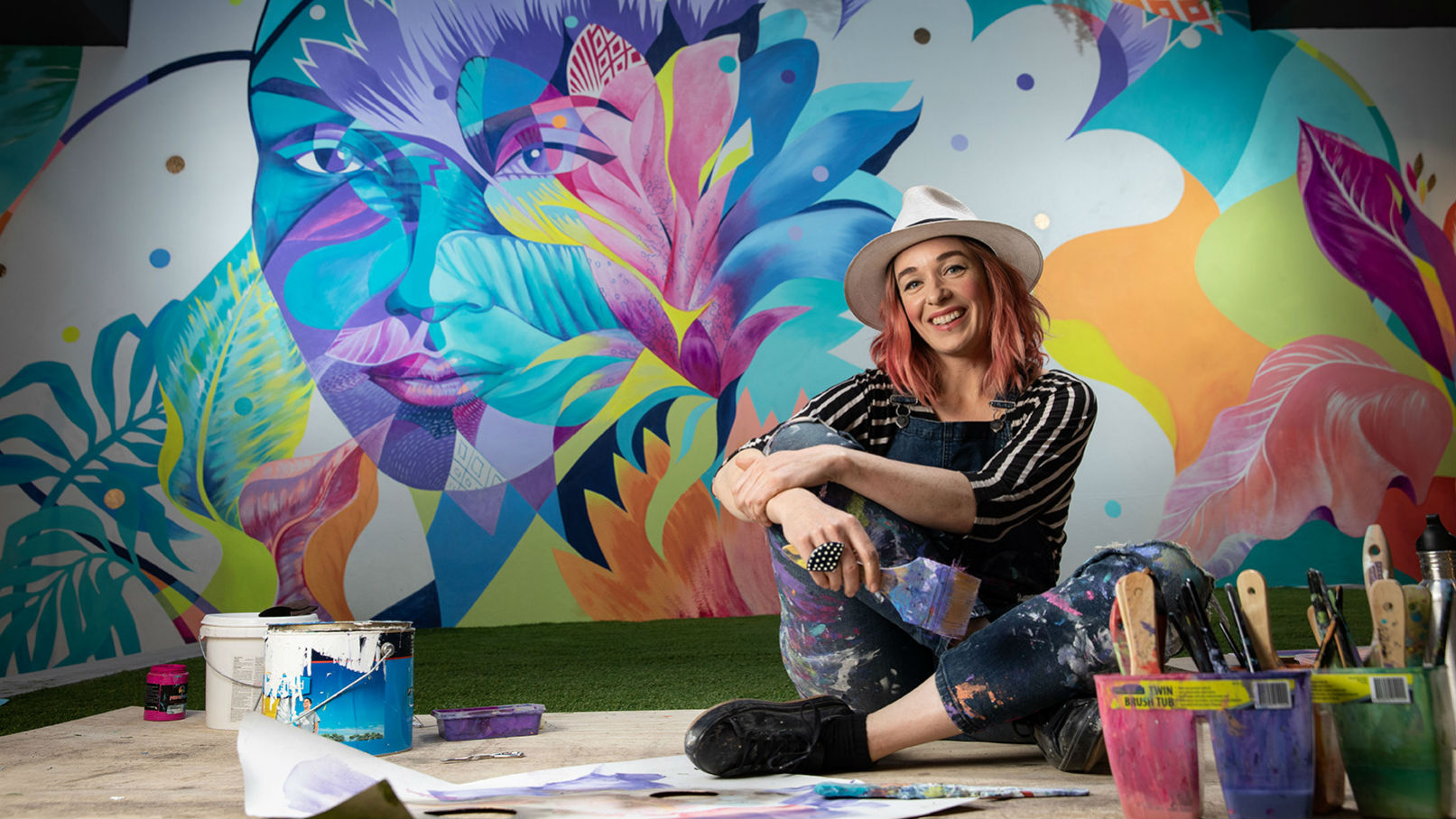 Accomplished international artist, Shannon Crees at the completion of her latest large scale mural work in our new Leichhardt branch.
