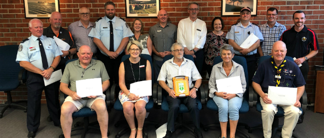 Community group photo of defibrillator presentation to local organisations in Dandenong Ranges area.