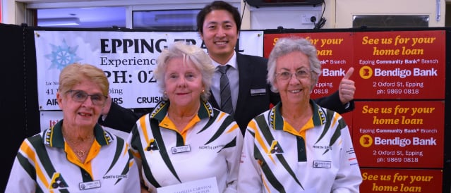 Three lady bowlers and Epping Community Bank Branch staff member standing outside club rooms.