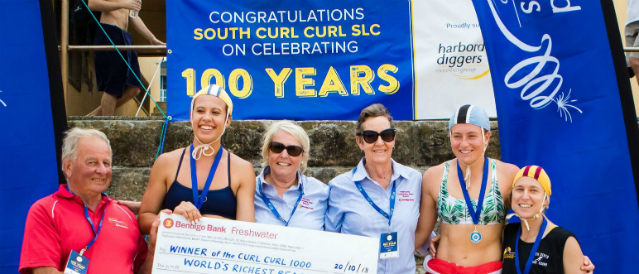 Club representatives with a large novelty cheque from Freshwater Community Bank Branch.
