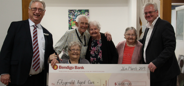 Fitzgerald House grant recipients pictured with novelty cheque and branch representatives.
