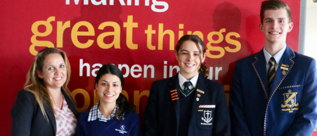 A branch staff member and three students who participated in the Magic Moments Youth Leadership Program.