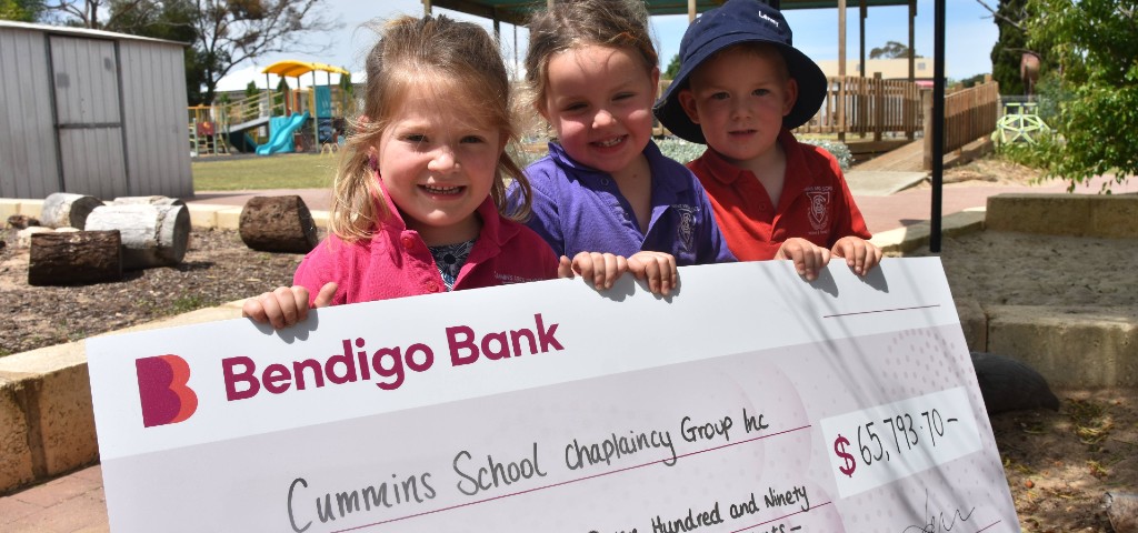 Preschool children holding cheque for $65,793.70 contribution for their Preschool and Rural Care Centre.