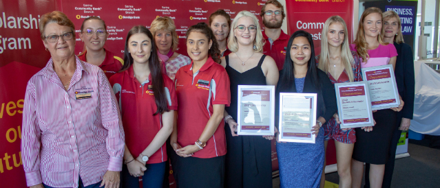 Sarina Community Bank Branch Chair standing with students who have received scholarships from the branch.