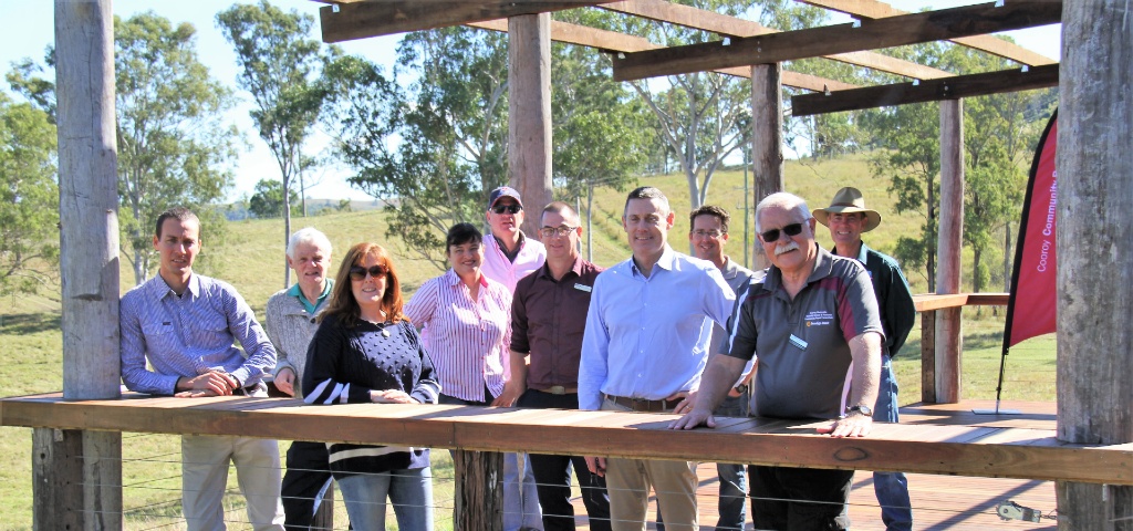 Photo of the Community Bank Director and staff of NDSHS celebrating the opening of the new community deck overlooking the 300 acre Mimburi Campus at Belli Park in the Mary Valley