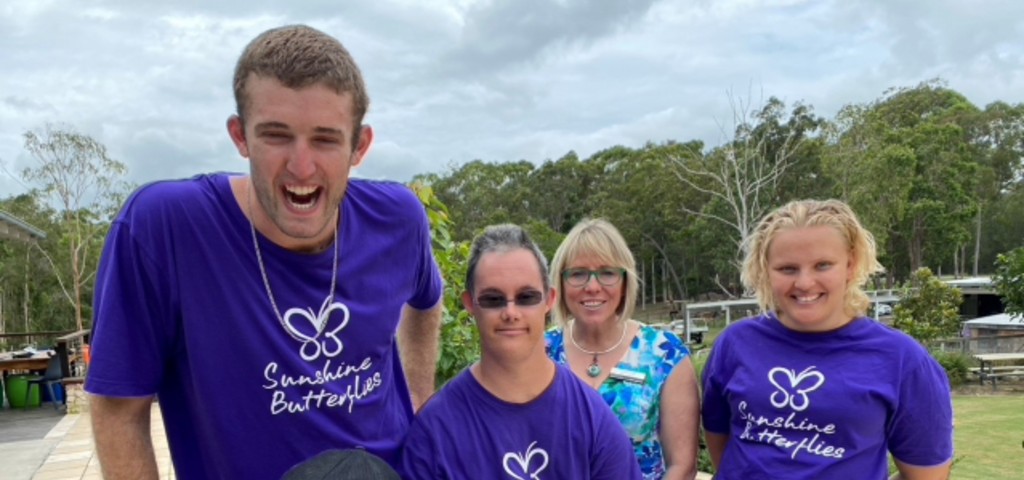 Photo of branch manager with the Sunshine Butterflies team