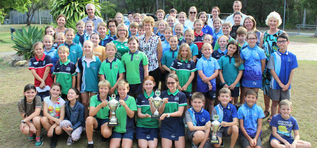 Branch staff join students from Noosaville, Tewantin, Cooroy and Cooran State Schools pictured in uniform.