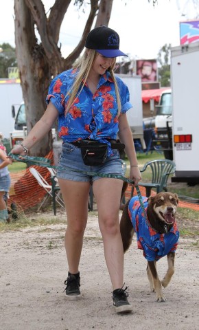 Female entrant in novelty dogs, with her dog, and they're in matching blue shirts.