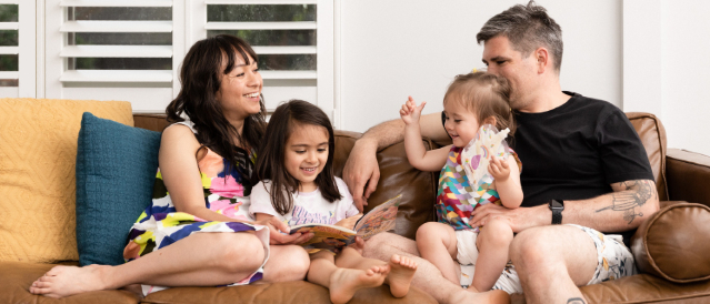 Woman doing yoga in her bedroom.